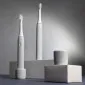 Электрическая звуковая зубная щетка Revyline RL 050, серая